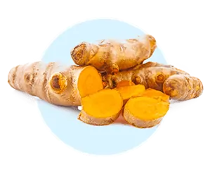 Golden turmeric powder and black peppercorns